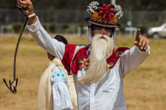 Chivo character in traditional attire performing at the cultural festival of Zuleta, Ecuador