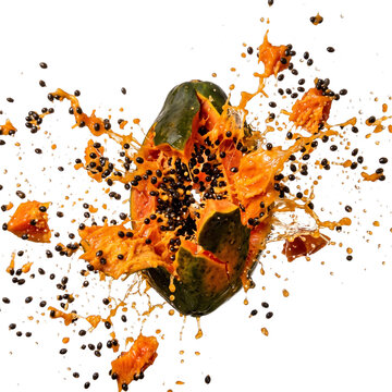 Exploding papaya fruit with flying seeds and juice splash isolated on white background papaya explosion tropical fruit pieces bursting papay