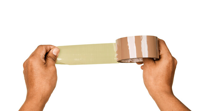 close up man hands pulling adhesive tape from a roll isolated on white. representing packaging, sealing and shipping preparation.