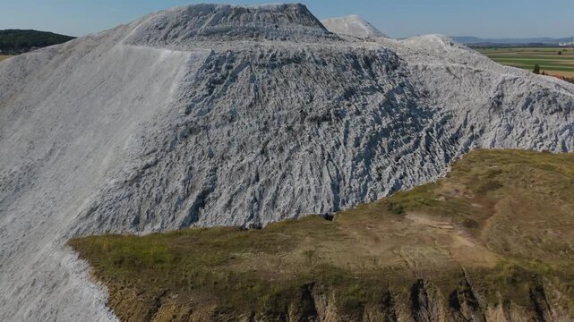 Salt Mountain Aerial Establishing Shot Over Quarried Face