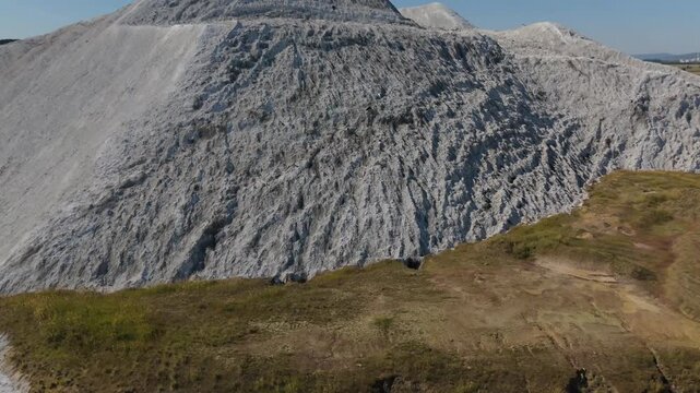 Salt Spoil Heap Frontal Aerial View Over Village