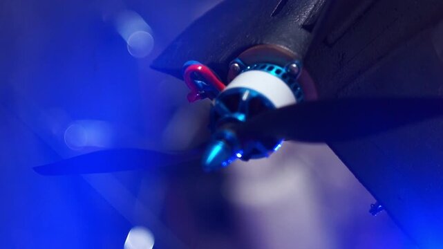 FPV drone brushless motor and propeller with blue lighting