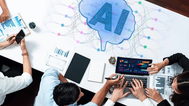 Creative Team Collaborating on Artificial Intelligence Strategies Using Laptop and Digital Tools in Modern Office Environment Sigmoid