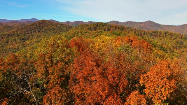 Beautiful autumn scenery across Appalachian Mountains of North Carolina. Colorful forests create picturesque landscape of rolling hills.