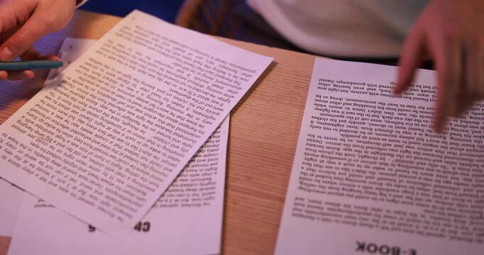 Writer working on his book in office at night, closeup