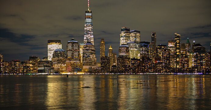 New York Manhattan golden panorama at night. New York panoramic cityscape. New York City iconic panorama, NYC. New York City travel destination.