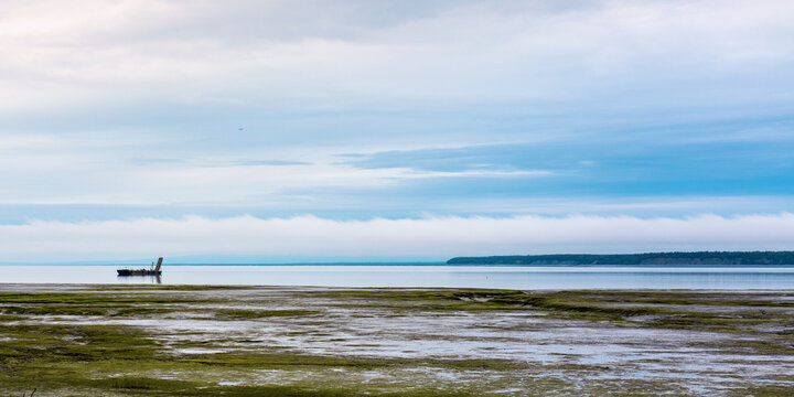 Anchorage Alaska seascape with view of Fire Island and mud beach at low tide at Knik Arm of Gulf of Alaska