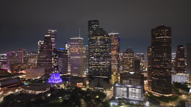 Downtown Houston skyline from above at night. Modern skyscrapers and transportation corridors shape this iconic Texas city.