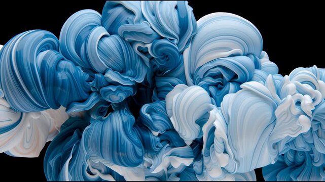 Paint mixes in water to form shapes resembling clouds. The deep blue and white colors swirl together in an interesting pattern.