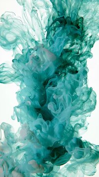 An ink cloud slowly spreads in clear water, created by backlighting, highlighting the flowing movement and color patterns.