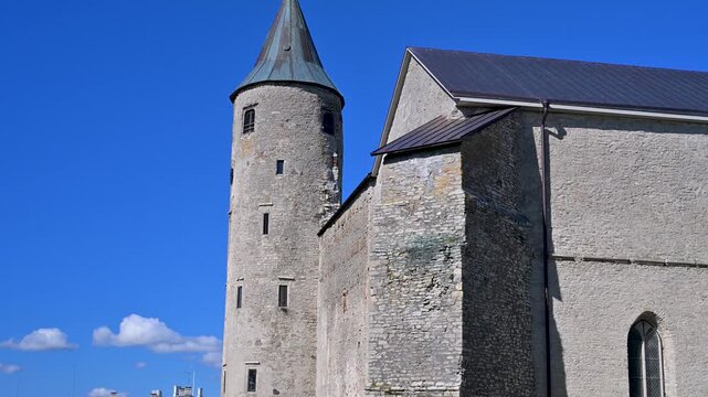 Haapsalu Castle stone watchtower and cathedral wall in Estonia