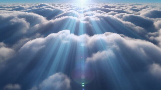 Dramatic sunbeams break through a dense layer of fluffy white clouds under a bright blue sky.