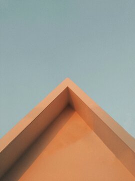 Minimalist Architecture Low Angle View of Triangular Roof Corner against Blue Sky