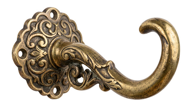 Vintage brass door handle features ornate scrollwork details and aged golden metal finish for historical house renovations and classic architectural designs.