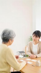 Fototapeta premium 月次の介護支援を振り返る高齢者と相談員