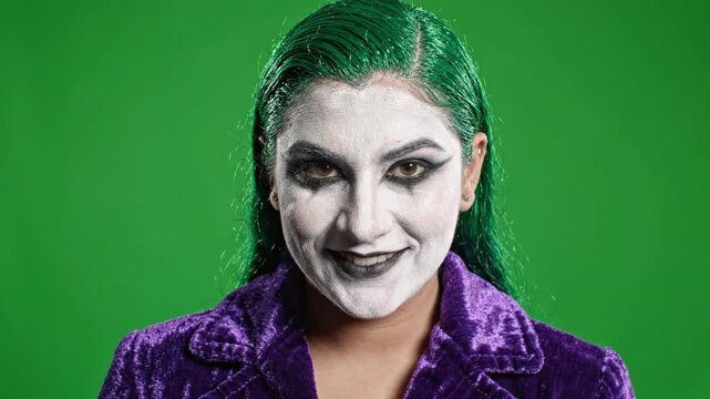 Woman with Joker Makeup Smiling Green Screen Chroma Key. 4K Video