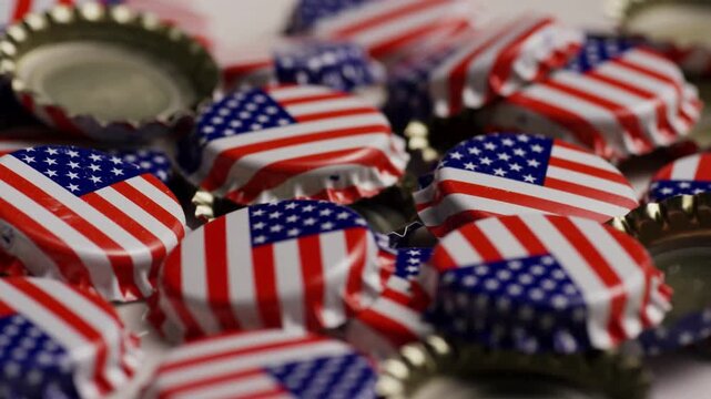 Bottle caps with American flag print rotating in pile