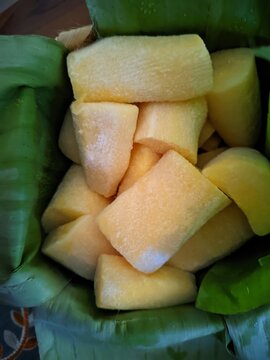 Fermented cassava root chunks, known as Tapai Singkong, served in a fresh banana leaf