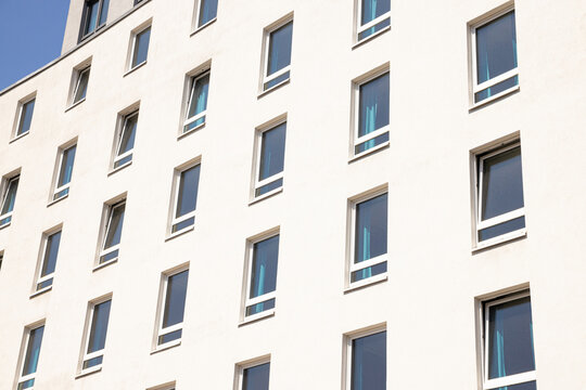 Building showcases clean lines and uniform windows reflecting sunlight