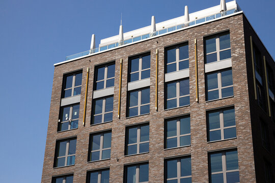 Contemporary building features multiple windows showcasing elegant architecture