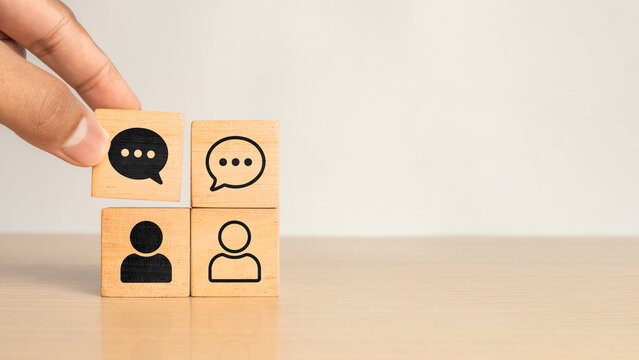 For negotiating business, deal, agreement, collaboration concept. Business communication for cooperation, partnership, contract agreement. Partner dialogue. Hand and business icon wooden cube blocks