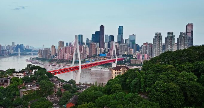 Aerial view of Dongshuimen Bridge and city skyline over the Yangtze River in Chongqing, China.