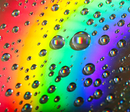 colorful drops on a rainbow background
