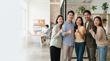 Fototapeta premium Group of Happy Young Adults Smiling and Giving Thumbs Up in Modern Office Environment with Plants and Light Decor