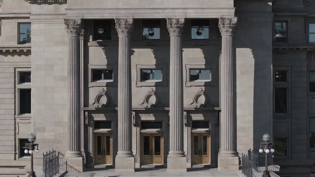 Smooth drone ascent from base to dome of Idaho state capitol