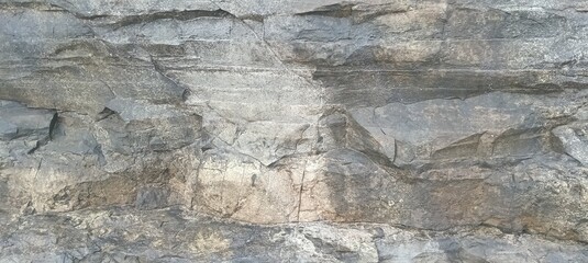 Fototapeta premium High angle view of rocky coastal shoreline with rough stone formations