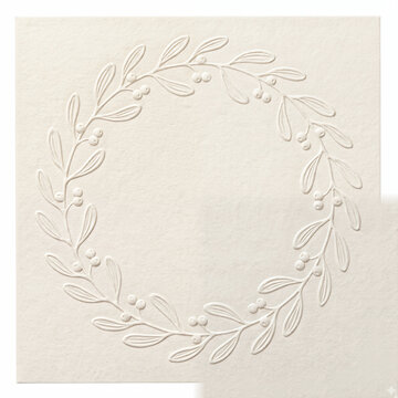 Generic blank cotton greeting card with embossed botanical mistletoe wreath border isolated on white.