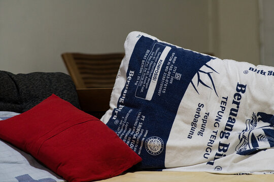 Pillowcase made of empty flour bag for the living room, a trend of recycling trash in Yogyakarta, 19 August 2026.