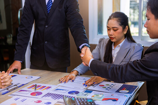 Businessman handshake at business meeting after negotiations with business partners. Selected focus