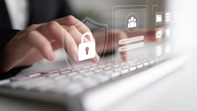 A focused business professional types on a keyboard with digital security icons, emphasizing the importance of cybersecurity and safe online practices in today corporate landscape. Cyphers