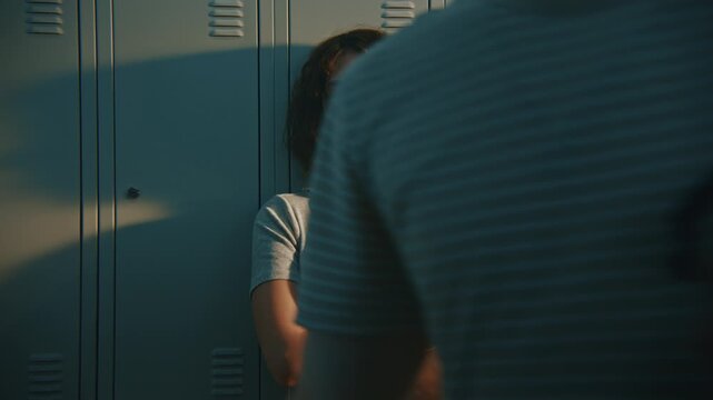 Portrait of Worried Young Girl Absorbed in Stress, Emotional Pain During Loud School Break. Youth Psychological Vulnerability, Social Anxiety Among Generation Z Students Within Academic Environment.