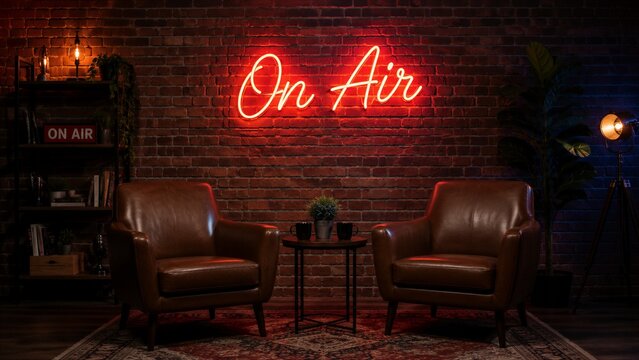 Two leather armchairs arranged facing each other in studio podcast set