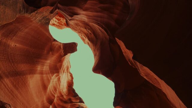 Slow upward move through a sandstone slot canyon, landscape orientation, sharp throughout