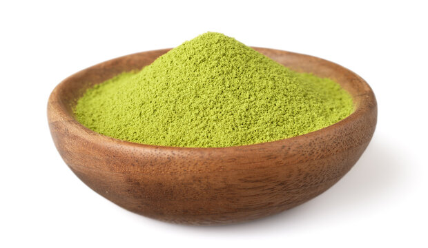 A small pile of matcha powder in the wooden plate, isolated on white background.