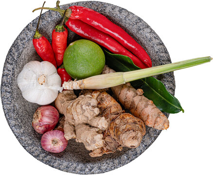 Top view raw ingredients red chilies green lime garlic in granite mortar isolated on transparent background