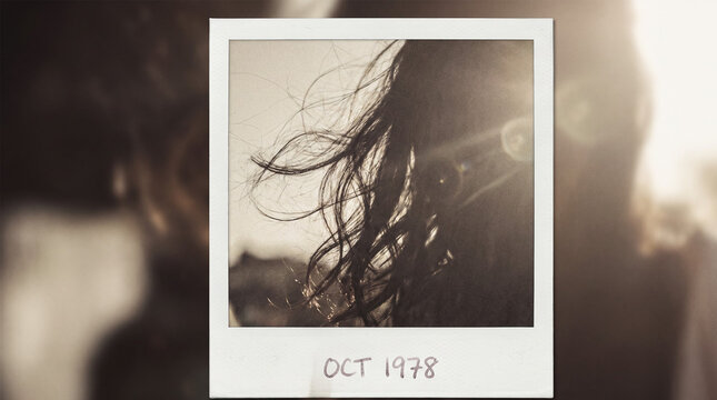 Vintage Polaroid 1978 Film Photo of Windblown Hair Silhouette in Golden Sun Flare