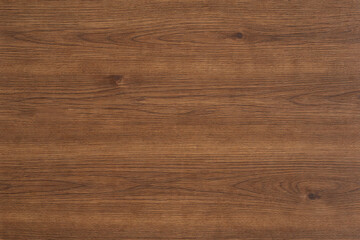 Rich walnut wood texture with natural grain patterns, warm brown tones, and subtle organic variations, ideal for furniture, interior surfaces, flooring, and realistic material backgrounds. © riorio