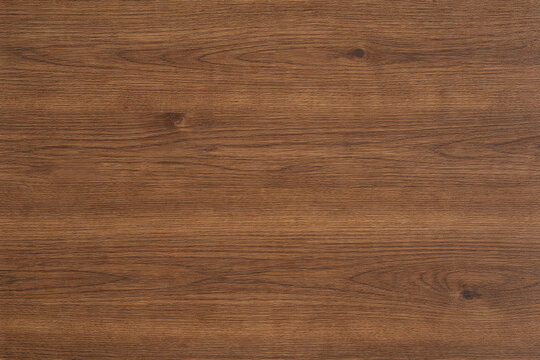 Rich walnut wood texture with natural grain patterns, warm brown tones, and subtle organic variations, ideal for furniture, interior surfaces, flooring, and realistic material backgrounds.