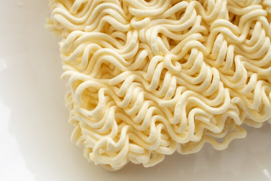 dry instant noodles texture background close up