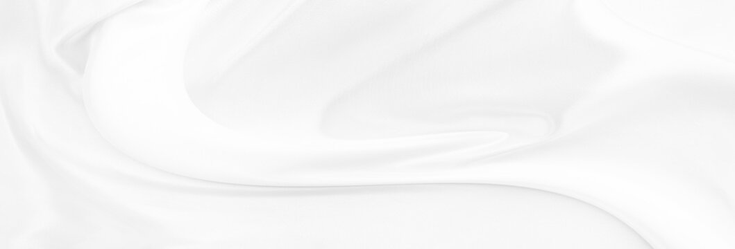 White gray satin texture that is white silver fabric silk panorama background with beautiful soft blur pattern natural.