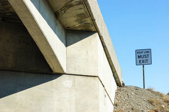 must exit sign on side of freeway