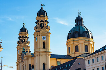 Theatine Church domes and towers silhouetted against a blue Munich sky © Serjedi
