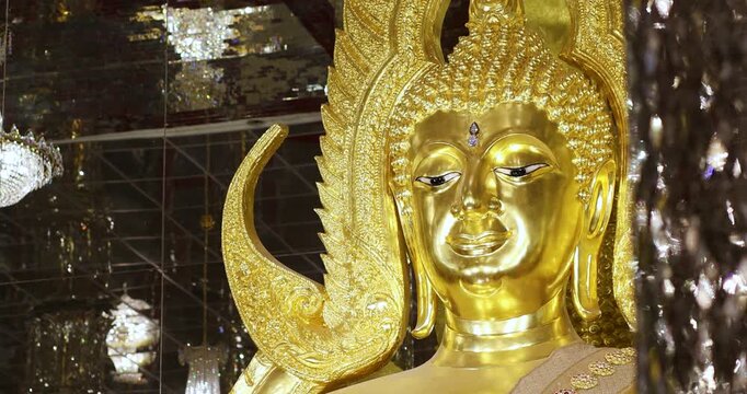 Golden Buddha statue inside a Buddhist temple. Elegant sacred architecture symbolizing peace, faith, spirituality, and Asian culture, ideal for travel, religion, and cultural projects