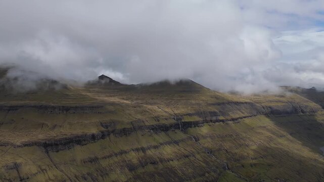 Aerial View of Foggy Mountains and Sl&aelig;ttaratindur Peak in Faroe Islands