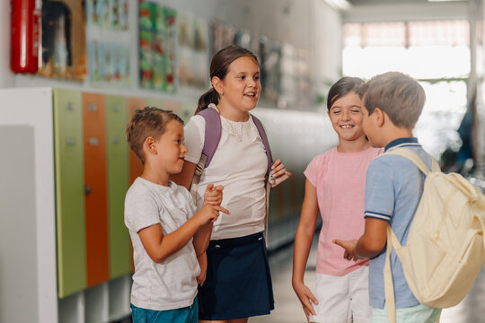 School children talking in hallway, back to school
