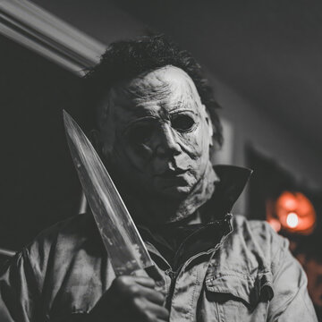 Masked killer knife horror costume dark portrait scary menace